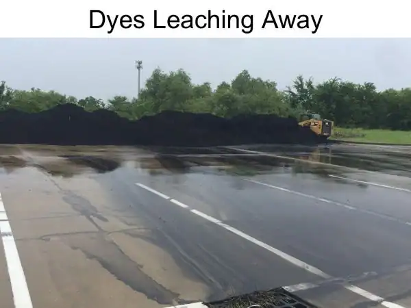 dyes from mulch leaching and staining a parking lot